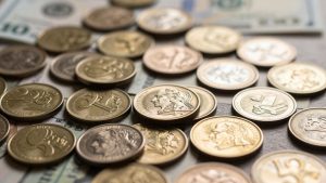 Global currency coins and banknotes, financial market background.