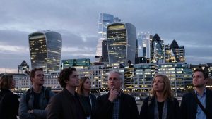 London cityscape with diverse individuals looking towards the skyline.