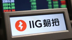 IG Group stock ticker with company logo visible.