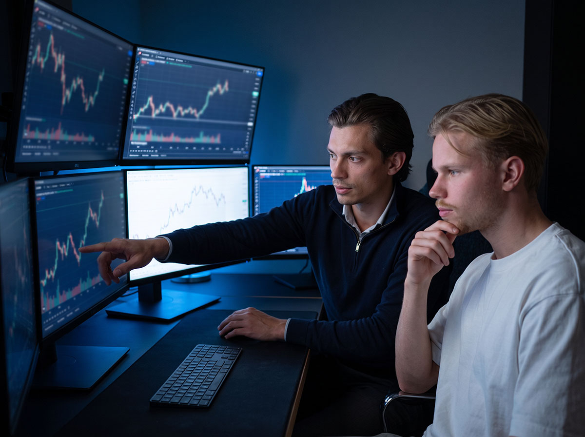 The Forex Complex team analysing Bitcoin and Ethereum markets on a multi-monitor trading desk