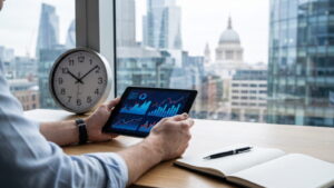 Trader checking an economic calendar on a tablet with a London skyline behind