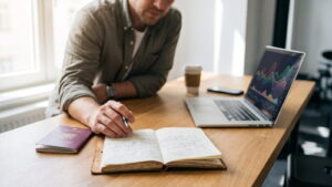 Trader reviewing a broker account page with notes and a passport on the desk